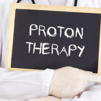 Proton therapy caption on mini blackboard